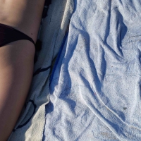 Hot girl laying on the beach in her purple bikini Bikniday (36).jpg