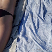 Hot girl laying on the beach in her purple bikini Bikniday (37).jpg