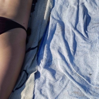 Hot girl laying on the beach in her purple bikini Bikniday (47).jpg