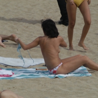 Topless girls on a beach in Barcelona 0206.jpg