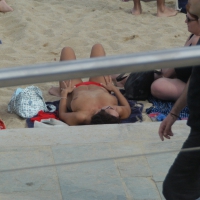 Topless girls on a beach in Barcelona 0108.jpg