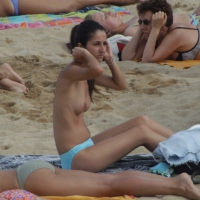 Topless girls on a beach in Barcelona 0115.jpg