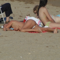 Topless girls on a beach in Barcelona 0202.jpg