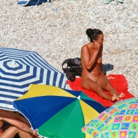 Ula FKK Sexy brunette on a nude beach topless, bottomless and with blue thong 0009.jpg