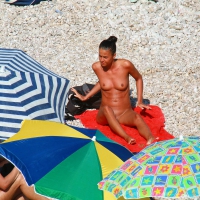 Ula FKK Sexy brunette on a nude beach topless, bottomless and with blue thong 0011.jpg