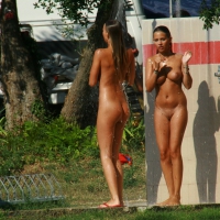 Two cute nudist girls showering completely naked on a hot day at the beach 0010.jpg