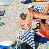 Ula FKK Sexy brunette on a nude beach topless, bottomless and with blue thong 0014.jpg