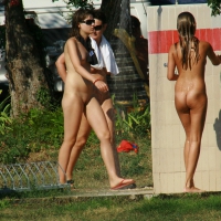 Two cute nudist girls showering completely naked on a hot day at the beach 0023.jpg