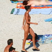 Ula FKK Sexy brunette on a nude beach topless, bottomless and with blue thong 0005.jpg