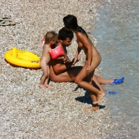 Ula FKK Sexy brunette on a nude beach topless, bottomless and with blue thong 0063.jpg