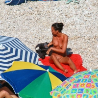 Ula FKK Sexy brunette on a nude beach topless, bottomless and with blue thong 0010.jpg