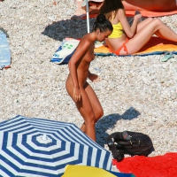 Ula FKK Sexy brunette on a nude beach topless, bottomless and with blue thong 0007.jpg