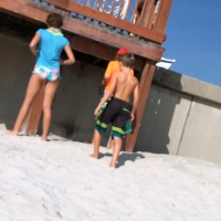Skinny bikini teen on the beach in a blue top 44492407CRc.jpg