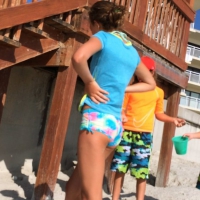 Skinny bikini teen on the beach in a blue top 44492418yLk.jpg