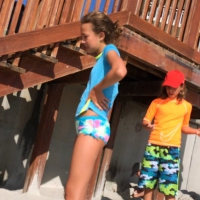 Skinny bikini teen on the beach in a blue top 44492416eou.jpg