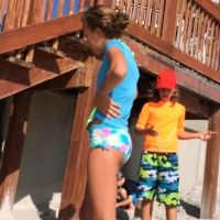 Skinny bikini teen on the beach in a blue top 44492417VaF.jpg