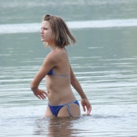 Skinny teen having fun in her little England bikini 38686368VKt.jpg
