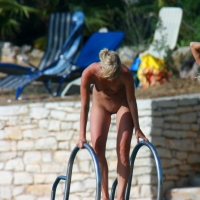 Sexy and skinny blonde nudist milf on the beach Skinny nudist blonde milf