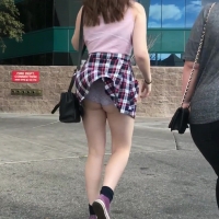 Wind blows her skirt