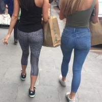 Sexy girl in leggings and friend in jeans