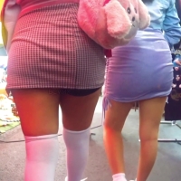 Two girls in skirts