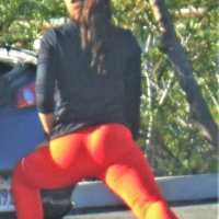 Asian chick stretching at her car