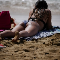 Sexy ass brunette on the beach