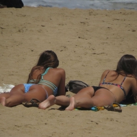 Two nice asses on the beach