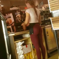 Employee in skin tight maroon leggings