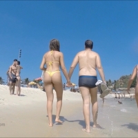 Beach babe in yellow thong
