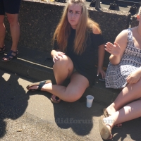 Sexy blonde girl showing her panties while sitting on the ground in a little skirt MJ630_P2240963.jpg