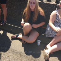 Sexy blonde girl showing her panties while sitting on the ground in a little skirt MJ630_P2240967.jpg