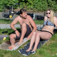 Thick blonde laying out in the sun in a bikini with her boyfriend Thick blonde laying out with her boyfriend