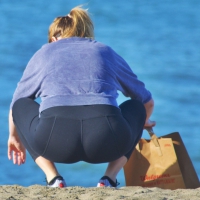 Beach blonde in leggings with a decent booty Beach blonde in leggings