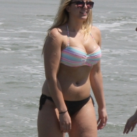 Big boobed thick blonde on the beach in a bikini Big boobed blonde on the beach