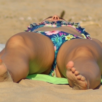 Blue floral bikini babe on the beach Blue floral bikini girl