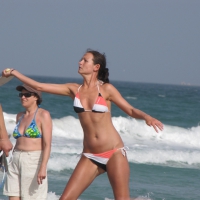 Skinny and sexy lady in a bikini playing on the beach Skinny lady on the beach
