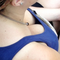 Mature lady downbloused sitting showing her cleavage Mature lady downblouse