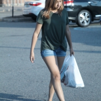 Cutie walking in the parking lot in jean shorts Cutie in jean shorts