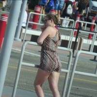 Girl in romper with nice legs and booty Girl in patterned romper