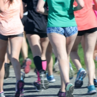 Group of running girls in shorts and spandex Running girls in shorts