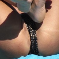 Sexy candid milf with her pussy lips peeking out of her bikini at the beach IMG_2228.JPG.c5af8b18866fe93f1b60b09640b44718.jfif