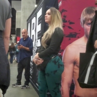 Candid hot blonde fitness chick with a phat ass in green leggings at an expo OG22 Knockout.mp4-2024-02-04-15h52m38s298.jpg