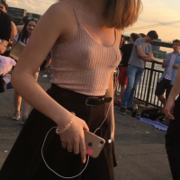 Braless beauty in tank top and skirt with puffy nipples Braless beauty in skirt