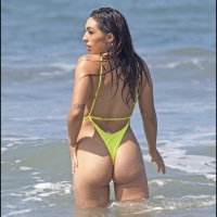 Sexy ass beach babe in a yellow...