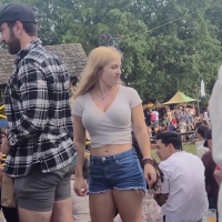 Busty candid blonde babe watching a joust in denim shorts and a tight top Busty Blonde Watching Joust.mp4-2023-02-18-14h21m11s340.jpg