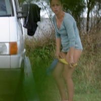 Girl getting out of her swimsuit and changing her panties while flashing pubes Girl changing panties after being in the water