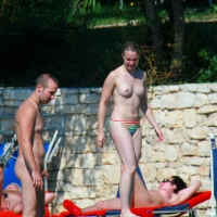 Nudist couple on nude beach shower Nudist couple shower