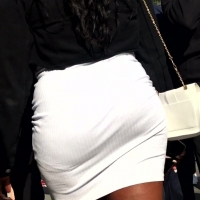 Black girl in white skirt
