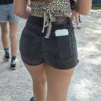 Festival babe in black shorts